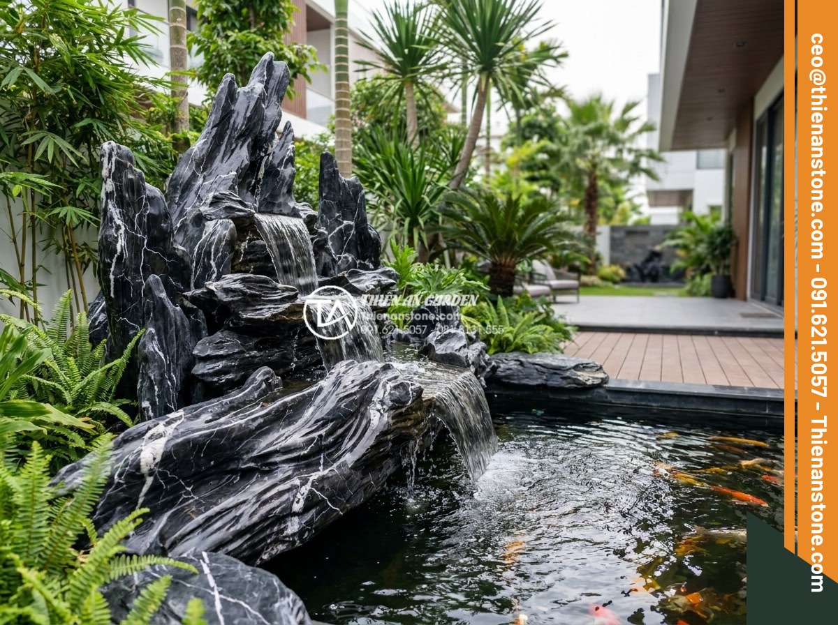 5 Sai lầm nghiêm trọng khi thi công thác nước sân vườn gây rò rỉ điện nước - Beautiful completed modern garden waterfall using premium treated natural stone,