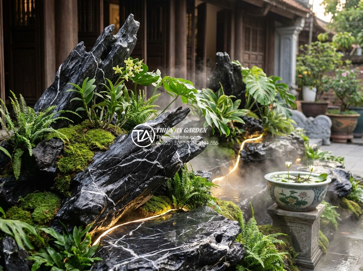 Cách sử dụng đá thấm thủy làm tiểu cảnh mini trước nhà cực độc đáo - Lush tropical plants and moss thriving on wet porous stones with soft water mist
