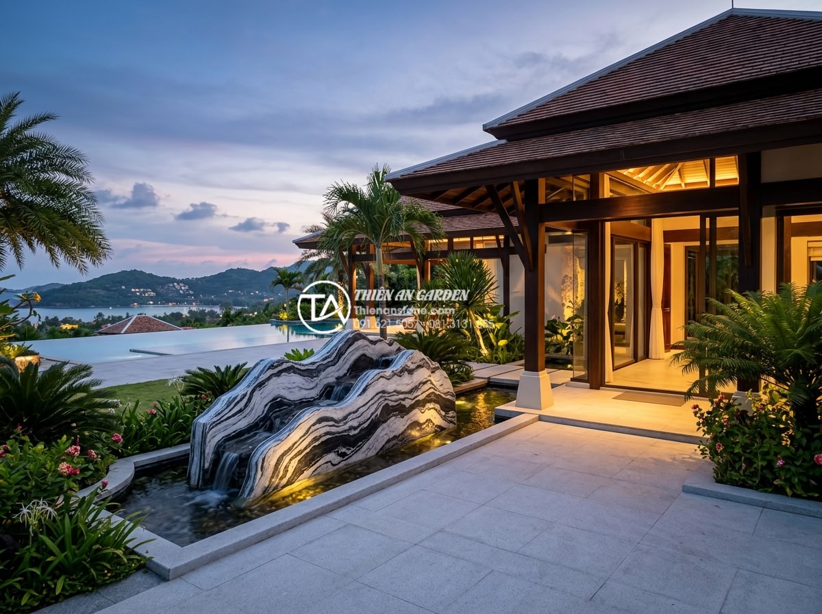 So sánh non bộ đá Tuyết Sơn và đá Cổ Thạch: Loại nào đẳng cấp hơn? - Hình 7 So sánh non bộ đá Tuyết Sơn và đá Cổ Thạch: Loại nào đẳng cấp hơn? - Elegant real estate photography of luxury villa entrance with stunning non-bo st
