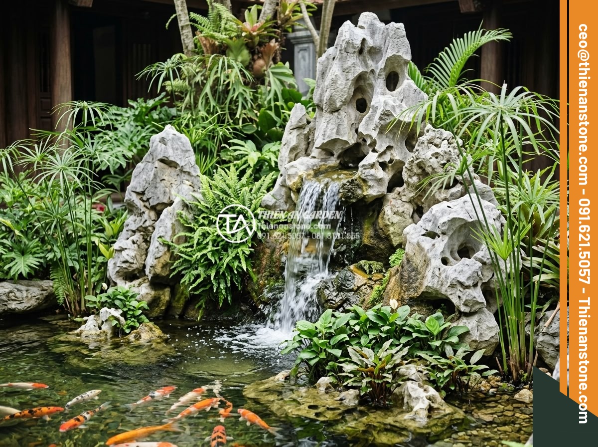 Top 10 loại cây thủy sinh và cây trang trí thác nước sân vườn đẹp nhất - Vibrant tropical garden scene with cascading natural stone waterfall surrounded 