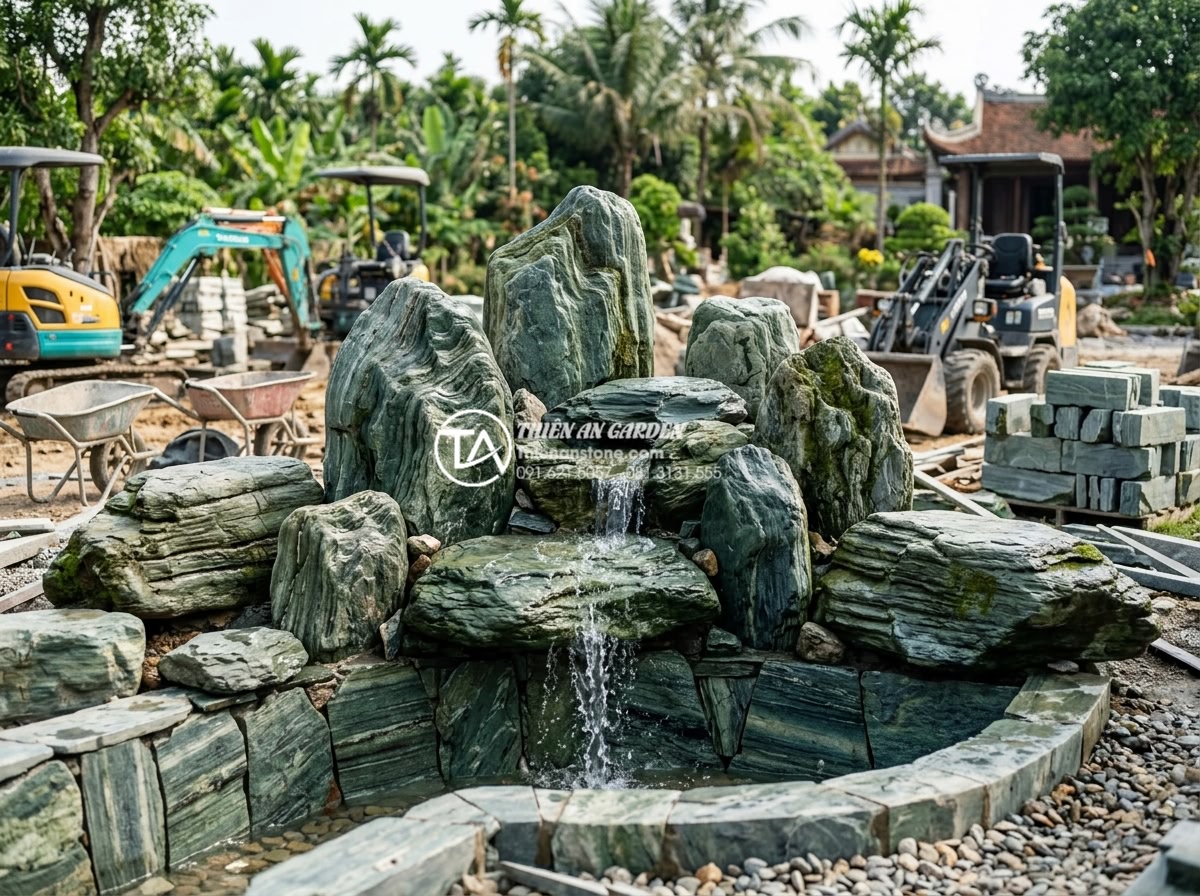 Xu hướng thiết kế tiểu cảnh thác nước sân vườn bền vững 2026 - Professional construction site photo of a sustainable garden waterfall being bui