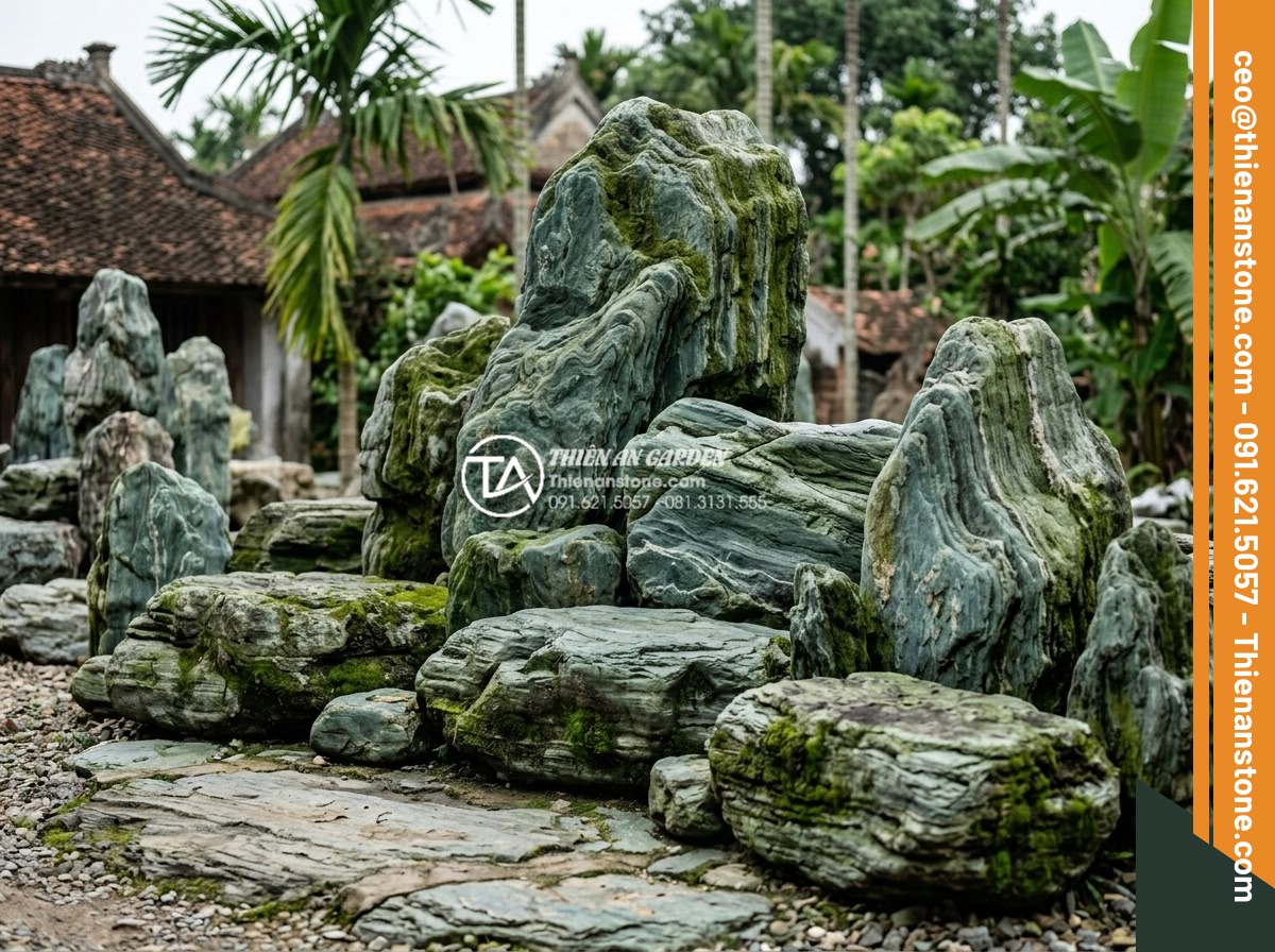 Cách xử lý rêu mốc cho tiểu cảnh làng quê ngoài trời vào mùa mưa - Expert team from stone company inspecting and treating moss on large outdoor vil
