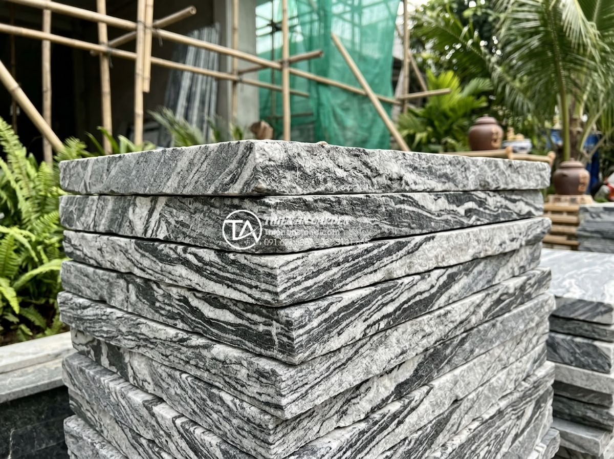 Case Study: Biến sân vườn cũ thành không gian tết đẳng cấp với tiểu cảnh đá - Close up detail of premium natural granite gray stone slabs with natural texture