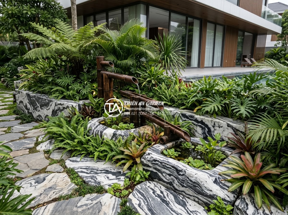 Báo giá thi công tiểu cảnh ống tre trọn gói mới nhất 2026 - Wide angle view of completed bamboo water feature in luxury villa garden, showin