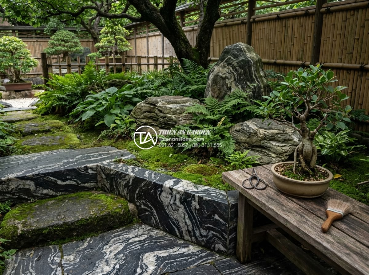Các loại cây phù hợp cho tiểu cảnh thiền chịu bóng và dễ chăm sóc - Professional gardener carefully maintaining a zen garden with shade loving plant