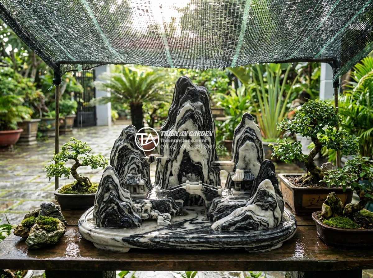 Giải đáp 10 câu hỏi thường gặp (FAQ) về bảo dưỡng tiểu cảnh đá mỹ nghệ - Stone art miniature landscape exposed to heavy rain and sun, showing protective 