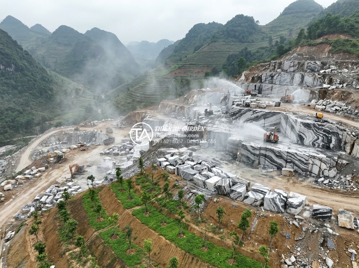 Quy trình chế tác bàn ghế đá nguyên khối từ khối đá thô đến tác phẩm hoàn thiện - Hình 6 Quy trình chế tác bàn ghế đá nguyên khối từ khối đá thô đến tác phẩm hoàn thiện - Wide aerial view of a modern stone quarry in northern Vietnam showing controlled