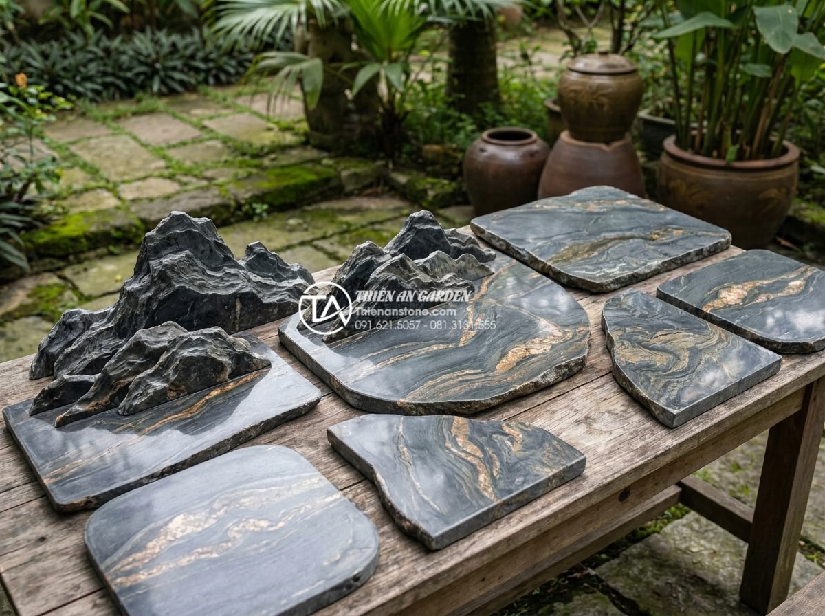 So sánh bàn ghế đá hoa cương và đá Marble: Loại nào tốt hơn cho ngoài trời? - Hình 6 So sánh bàn ghế đá hoa cương và đá Marble: Loại nào tốt hơn cho ngoài trời? - Artistic overhead shot of various granite and marble stone samples arranged for