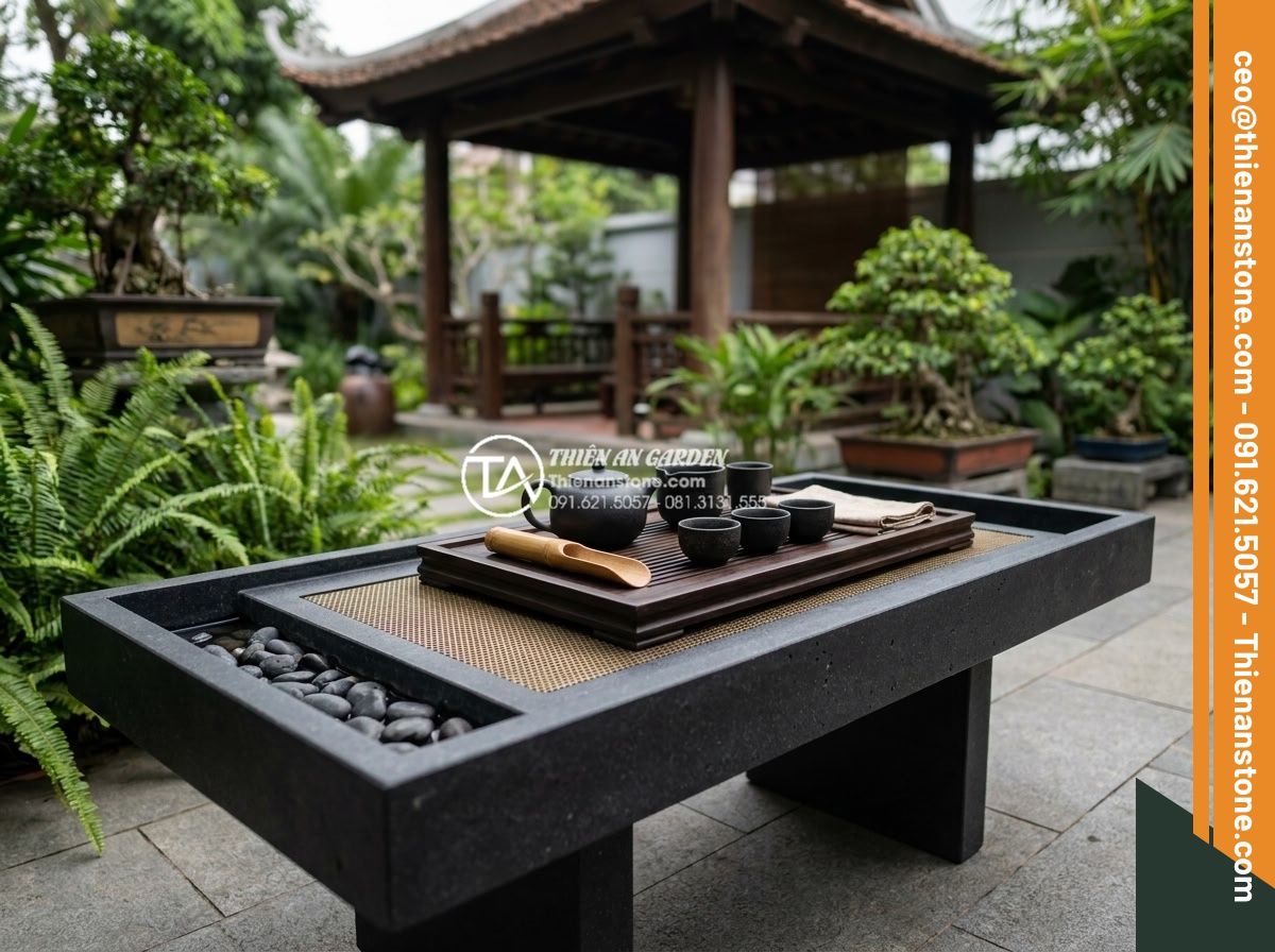 Bàn trà đá bazan (đá đen): Sự lựa chọn tối giản cho không gian hiện đại - Hình 10 Bàn trà đá bazan (đá đen): Sự lựa chọn tối giản cho không gian hiện đại - Beautifully styled black basalt tea table with matching tea set, ceramic cups, t