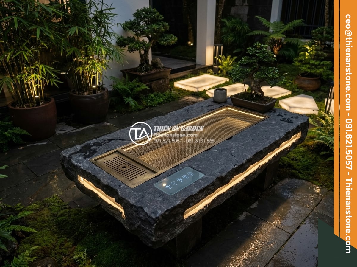 Bàn trà đá bazan (đá đen): Sự lựa chọn tối giản cho không gian hiện đại - Hình 19 Bàn trà đá bazan (đá đen): Sự lựa chọn tối giản cho không gian hiện đại - Futuristic yet natural image of a modern black basalt tea table with subtle inte