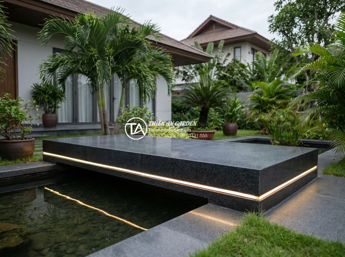 Cách chọn đá tự nhiên làm cầu sân vườn bền bỉ và không bị rêu mốc - Premium quality image of a sleek modern granite garden bridge with minimalist de