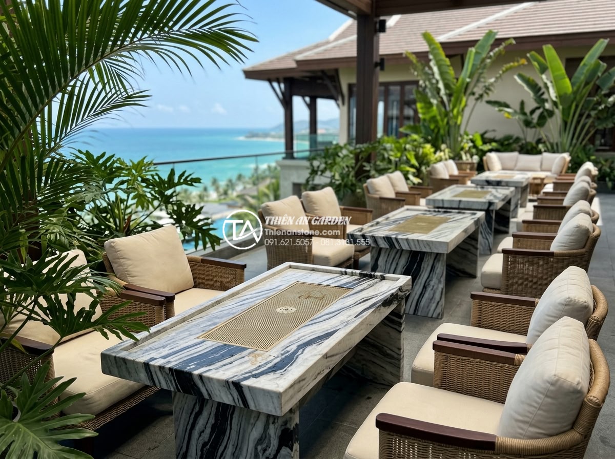 Case Study: Thi công hệ thống bàn trà đá nguyên khối cho Resort 5 sao - Side angle view of elegant solid stone tea tables arranged in a resort outdoor l
