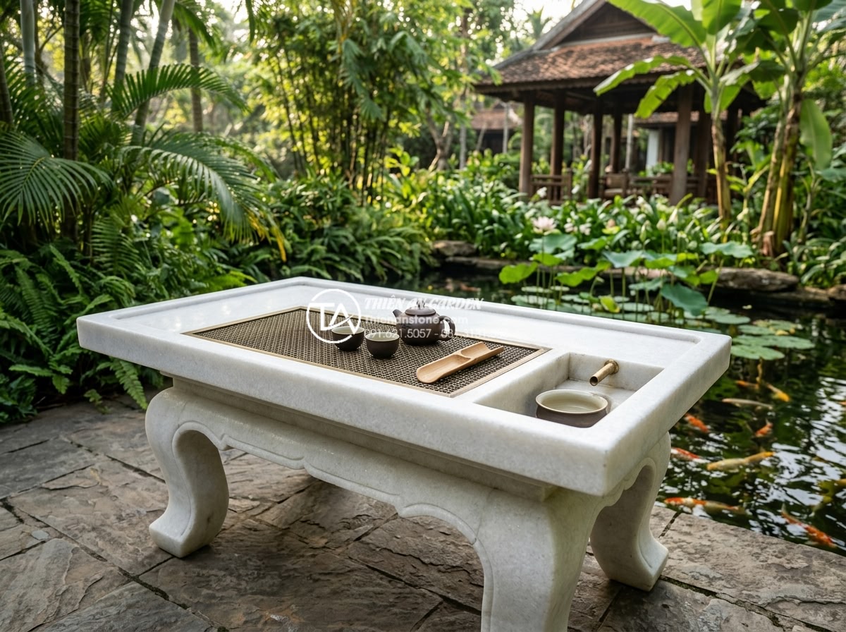Làm thế nào để chọn màu sắc bàn trà đá hợp mệnh Kim, Mộc, Thủy, Hỏa, Thổ? - A serene Vietnamese luxury garden scene featuring a large natural white and gray