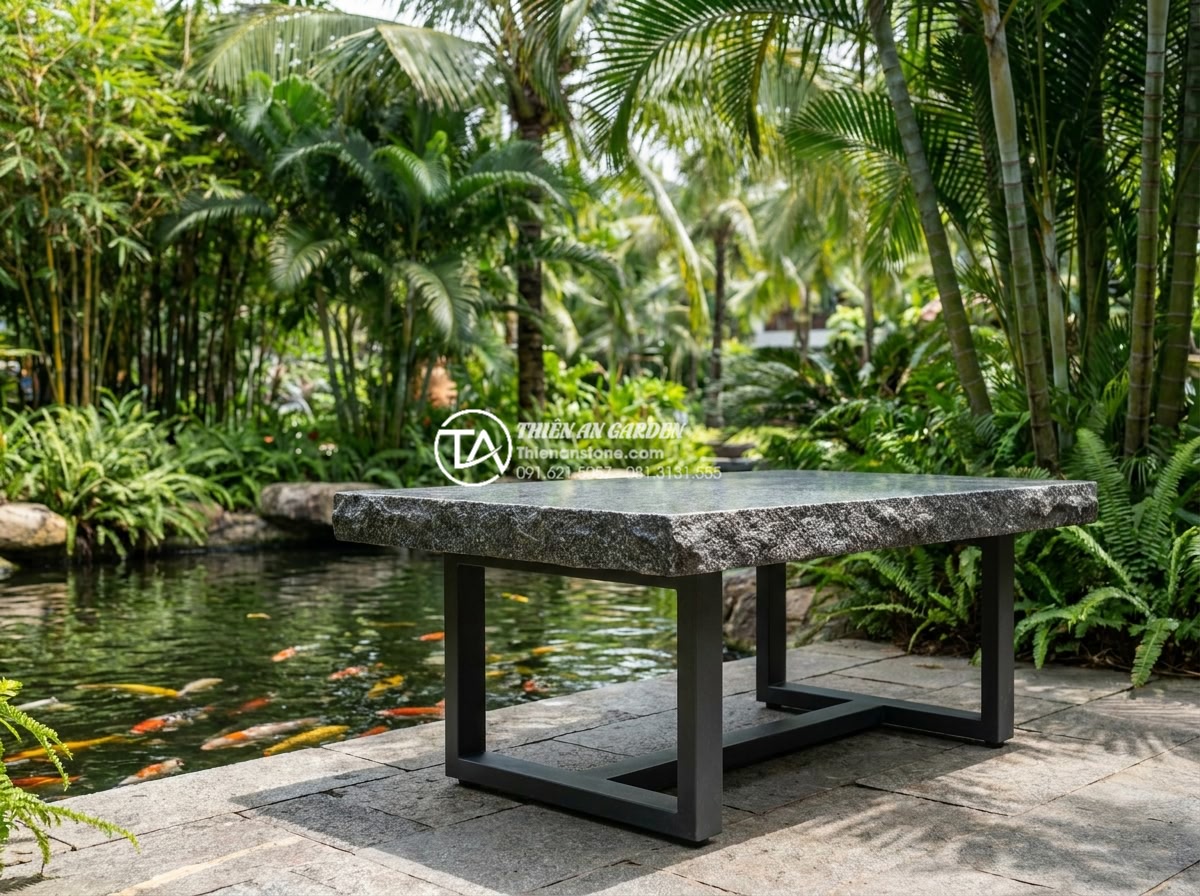 Mặt bàn trà bằng đá: Nên chọn đá Marble, Granite hay đá Cuội tự nhiên? - Durable dark gray granite outdoor tea table in a tropical resort garden, speckle