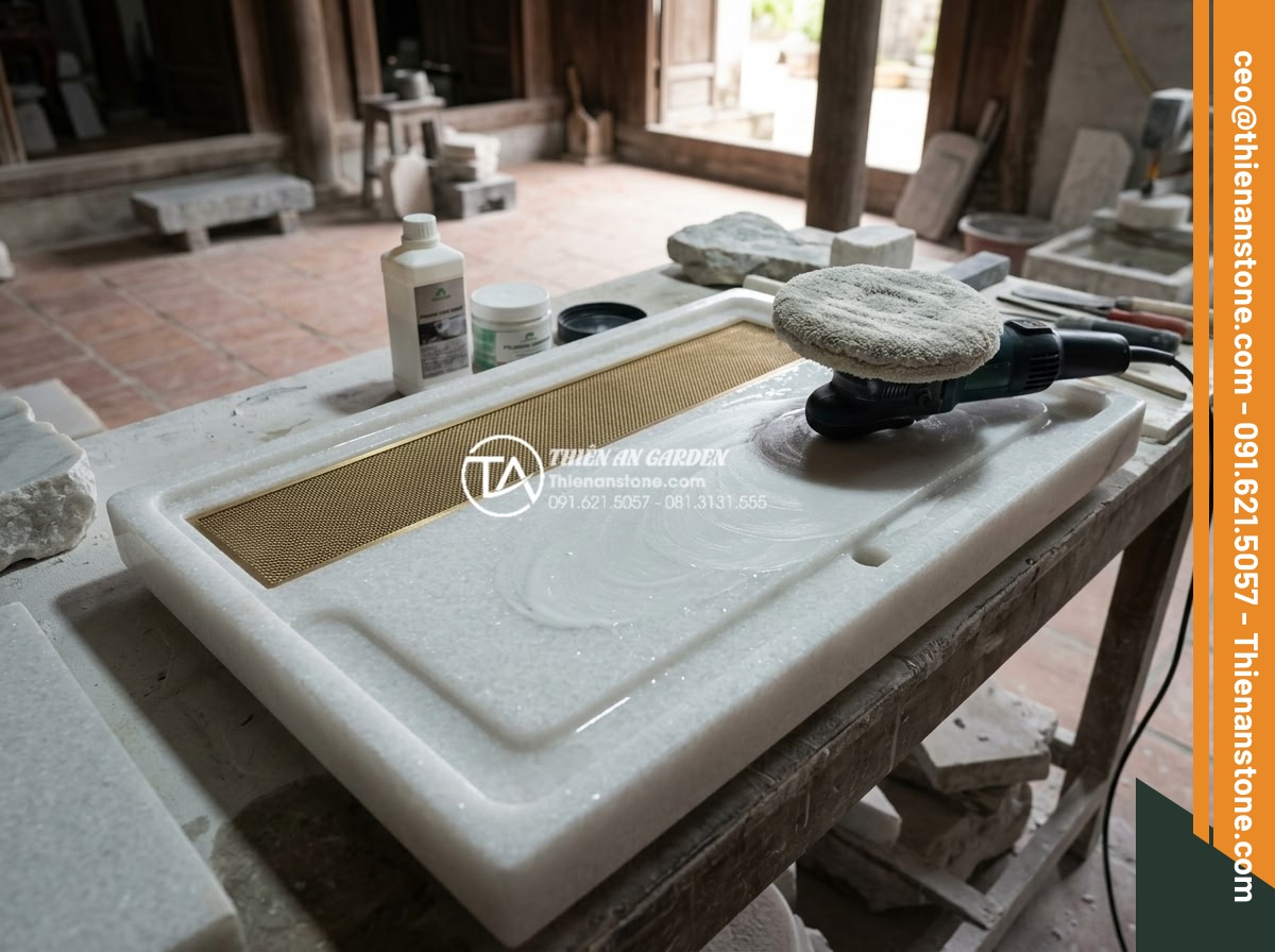 Quy trình chế tác bàn trà đá nguyên khối từ khối đá thô đến tác phẩm nghệ thuật - Artisan applying premium stone sealer and polishing compound on freshly honed gr