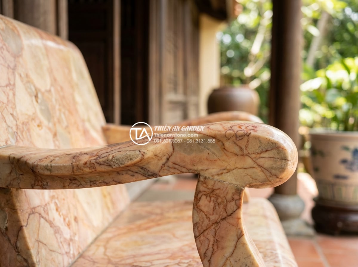 Review thực tế: Sử dụng bàn ghế đá hoa cương sau 10 năm sẽ như thế nào? - Close-up realistic photograph of a well-maintained granite stone chair armrest a