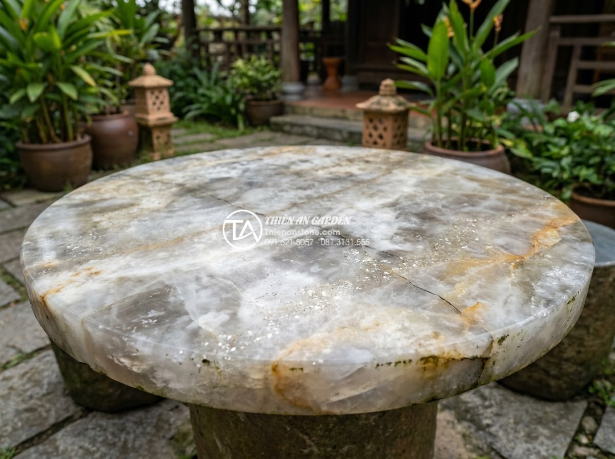 Review thực tế: Sử dụng bàn ghế đá hoa cương sau 10 năm sẽ như thế nào? - Realistic professional photo of a granite stone table with minor natural patina 