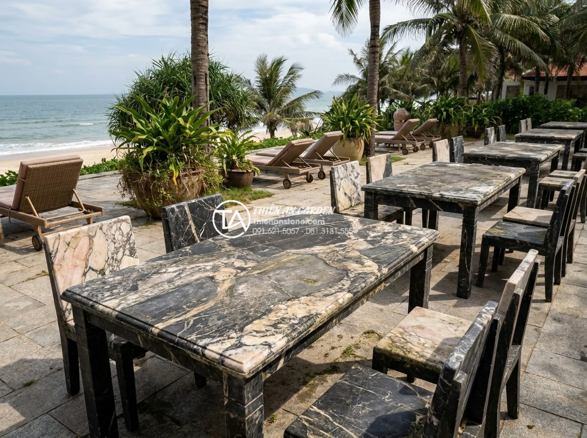 Review thực tế: Sử dụng bàn ghế đá hoa cương sau 10 năm sẽ như thế nào? - Realistic documentary style photograph of a luxury beach resort patio with multi