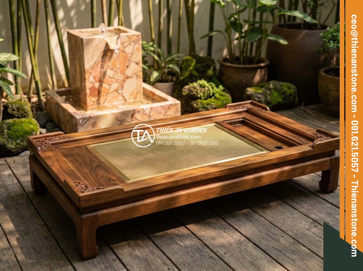 So sánh bàn trà đá nguyên khối và bàn trà gỗ: Lựa chọn nào cho sân vườn? - Beautiful handcrafted wooden tea table made from premium teak wood, placed on a 
