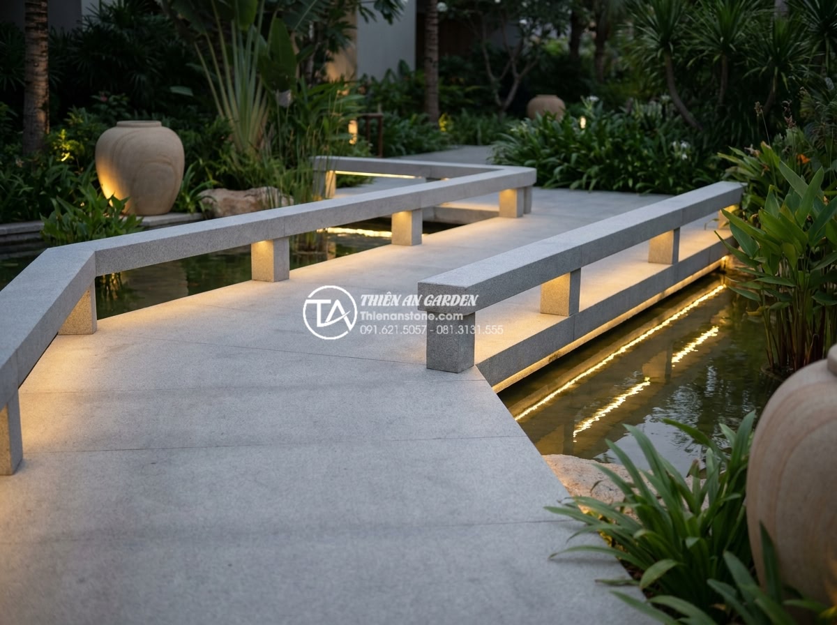 Sự khác biệt giữa đá Granite và đá Cẩm Thạch khi chế tác cầu sân vườn - Modern minimalist granite garden bridge design with integrated LED lighting and 
