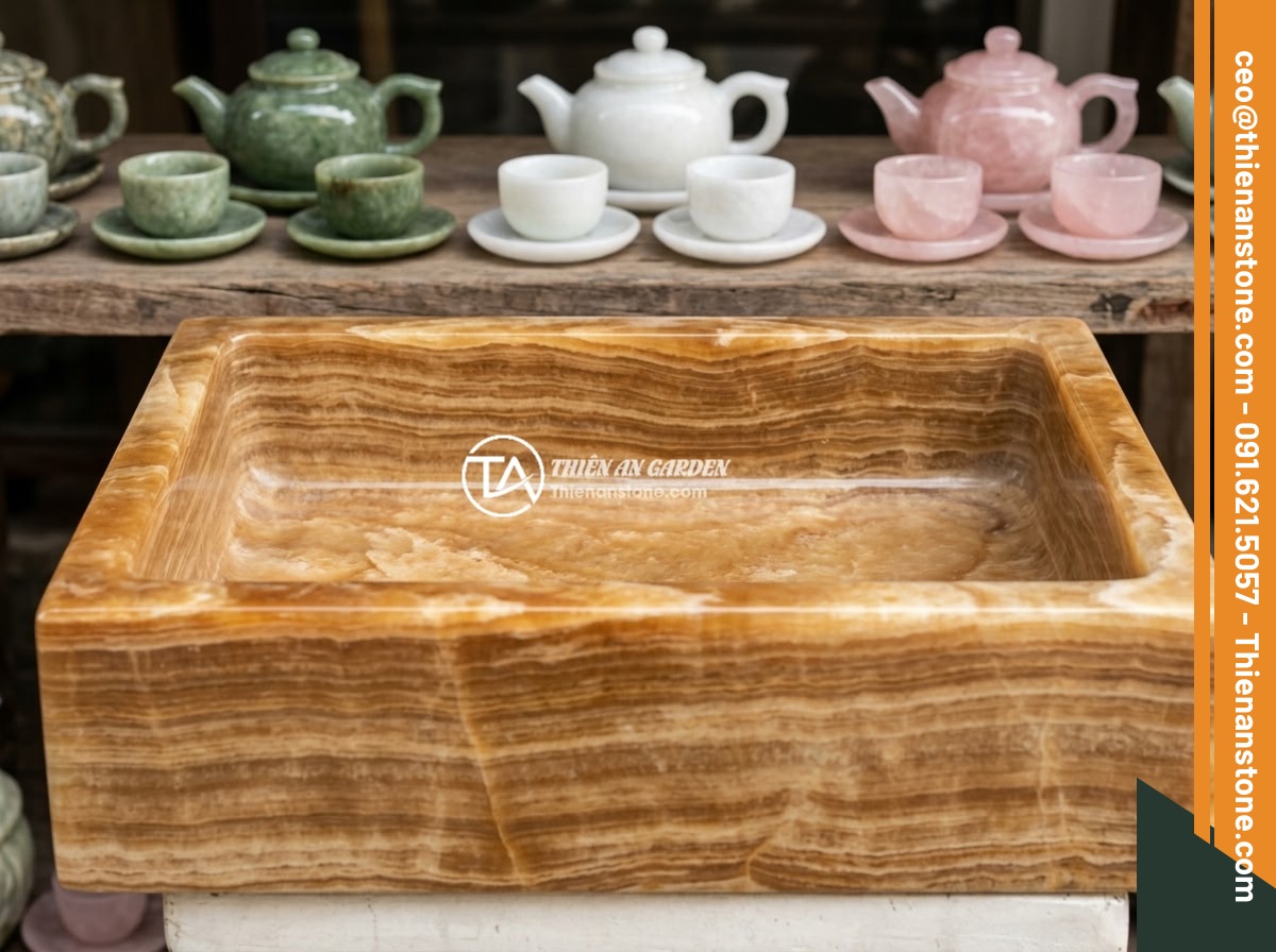 Bộ ấm chén đá ngọc: Ý nghĩa phong thủy, tài lộc và cách nhận biết chất lượng - Hình 5 Bộ ấm chén đá ngọc: Ý nghĩa phong thủy, tài lộc và cách nhận biết chất lượng - Various types of jade stone tea sets displayed together showing different colors