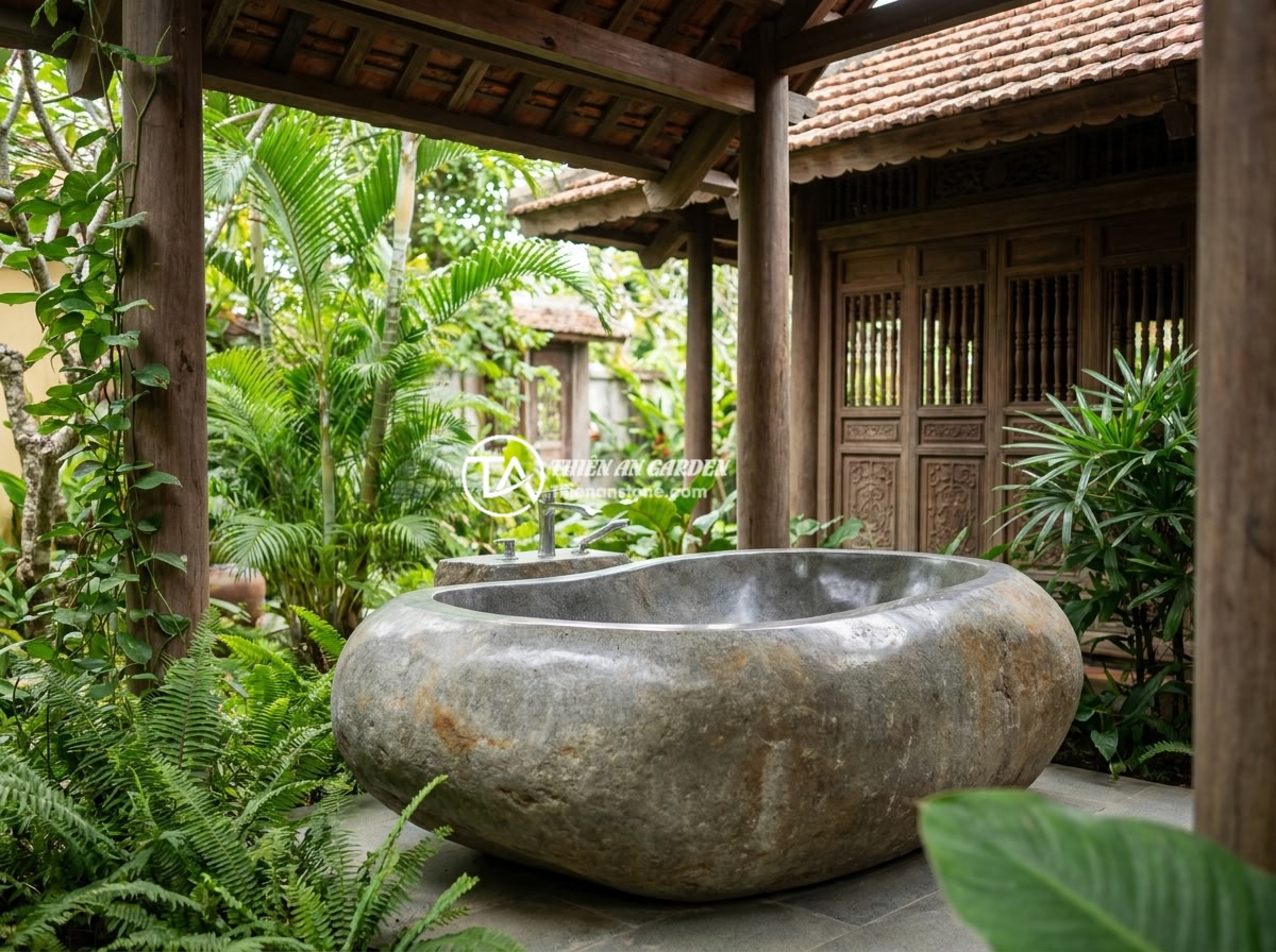 Bồn Tắm Đá Tự Nhiên Là Gì? Ưu Nhược Điểm Và Ứng Dụng Thực Tế 2026 - An FAQ-style image showing a completed natural stone bathtub installation in a V
