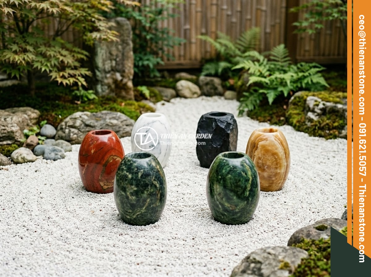 Chum đá phong thủy là gì? Ý nghĩa phong thủy và cách sử dụng trong thiết kế sân vườn - Hình 5 Chum đá phong thủy là gì? Ý nghĩa phong thủy và cách sử dụng trong thiết kế sân vườn - Five feng shui stone urns in different colors representing the five elements - w