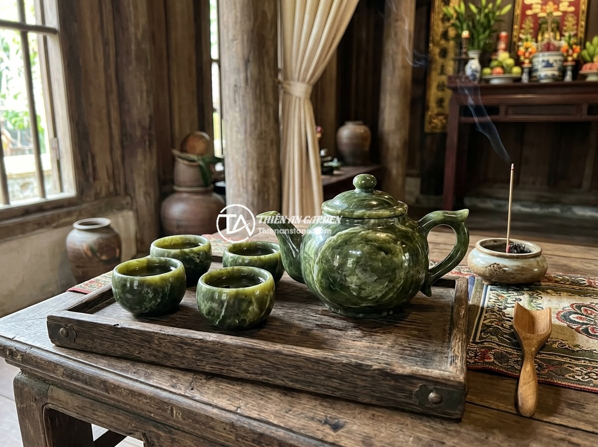 Có nên mua bộ ấm chén đá để làm quà tặng phong thủy không? - A luxurious natural stone tea set displayed on a wooden tea tray, with elegant j