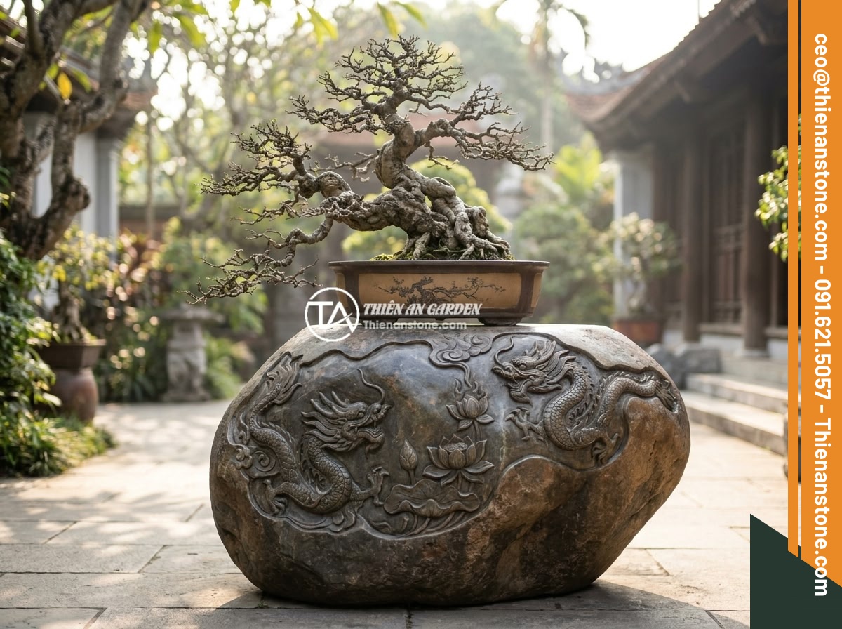 Đôn đá kê cây cảnh lớn cho không gian rộng: Gợi ý mẫu và kích thước phù hợp - An elegant carved natural stone pedestal with traditional Vietnamese dragon and 