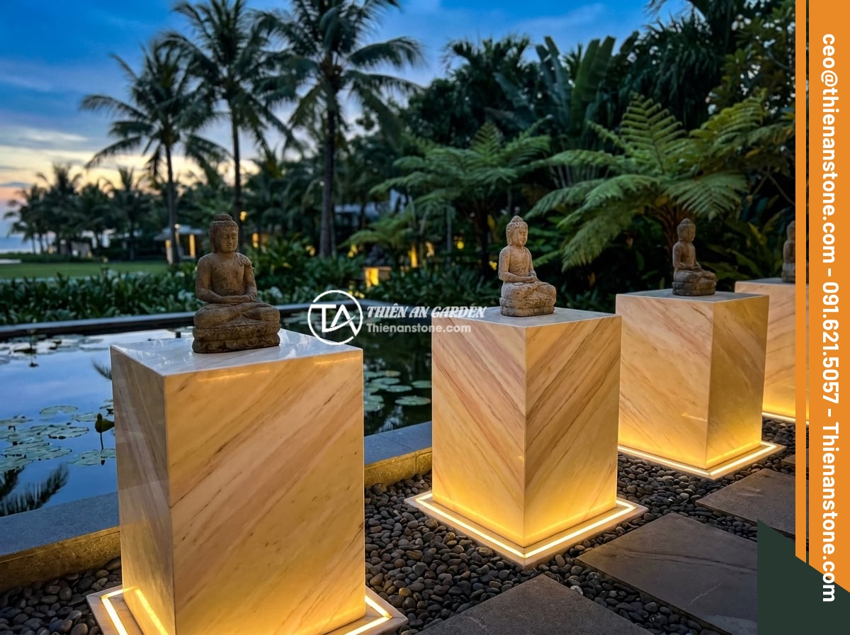 Đôn đá kê tượng phong thủy: Cách chọn và đặt vị trí mang lại tài lộc, bình an - A modern tropical resort garden in Vietnam featuring minimalist natural stone pe