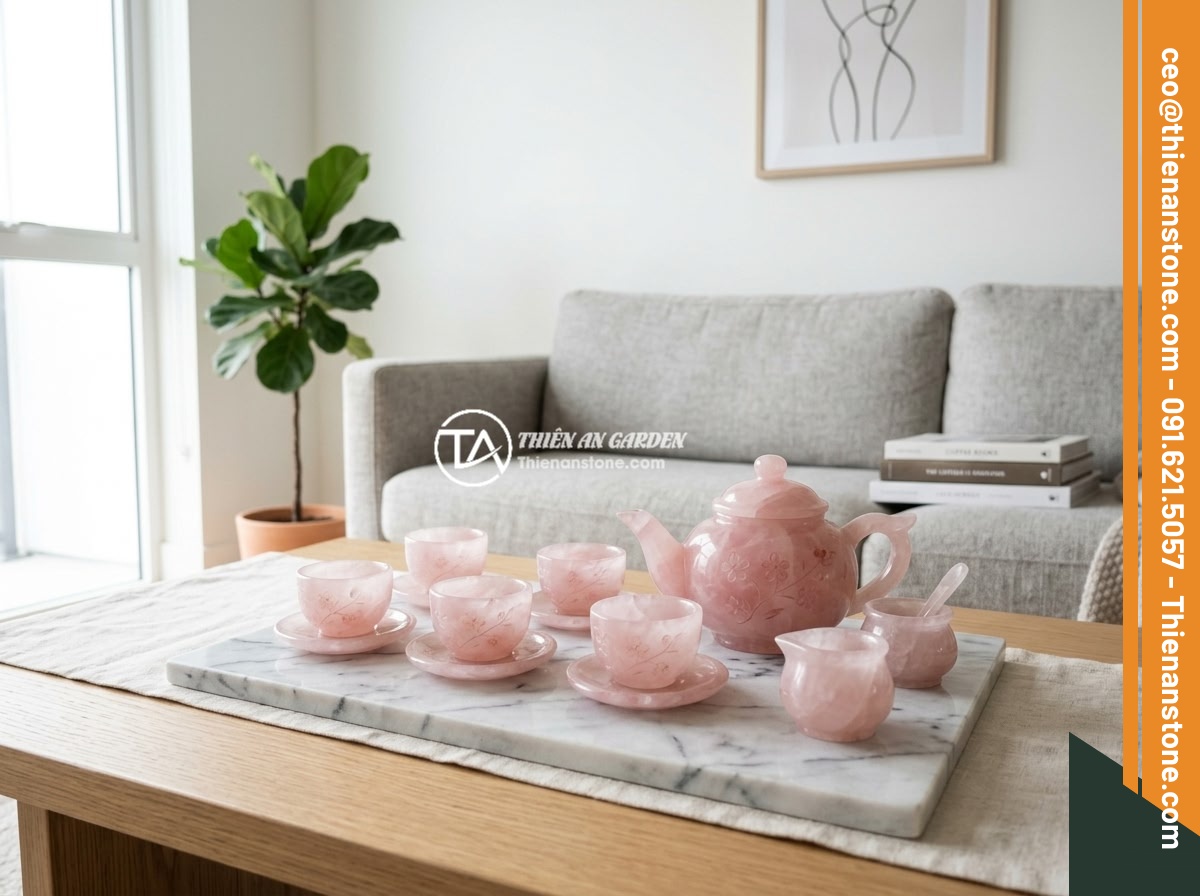 Top 8 bộ ấm chén bằng đá sang trọng và đẹp nhất cho không gian sống 2026 - A delicate rose quartz stone tea set with carved floral patterns arranged on a m
