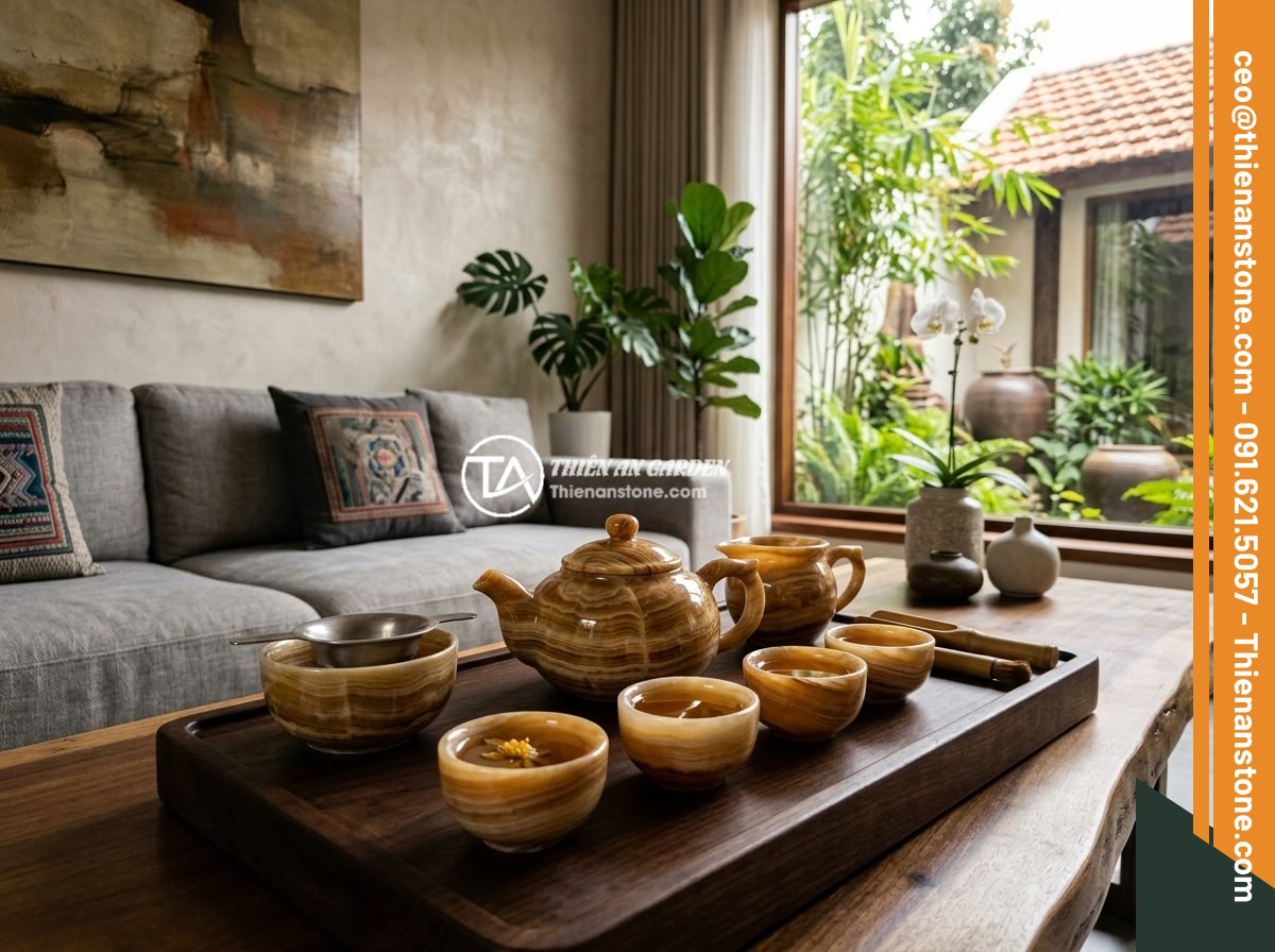 Xu hướng bộ ấm chén đá tự nhiên trong thiết kế nhà ở Việt Nam 2026 - A luxurious natural stone tea set displayed on a wooden tea tray in a modern Vie