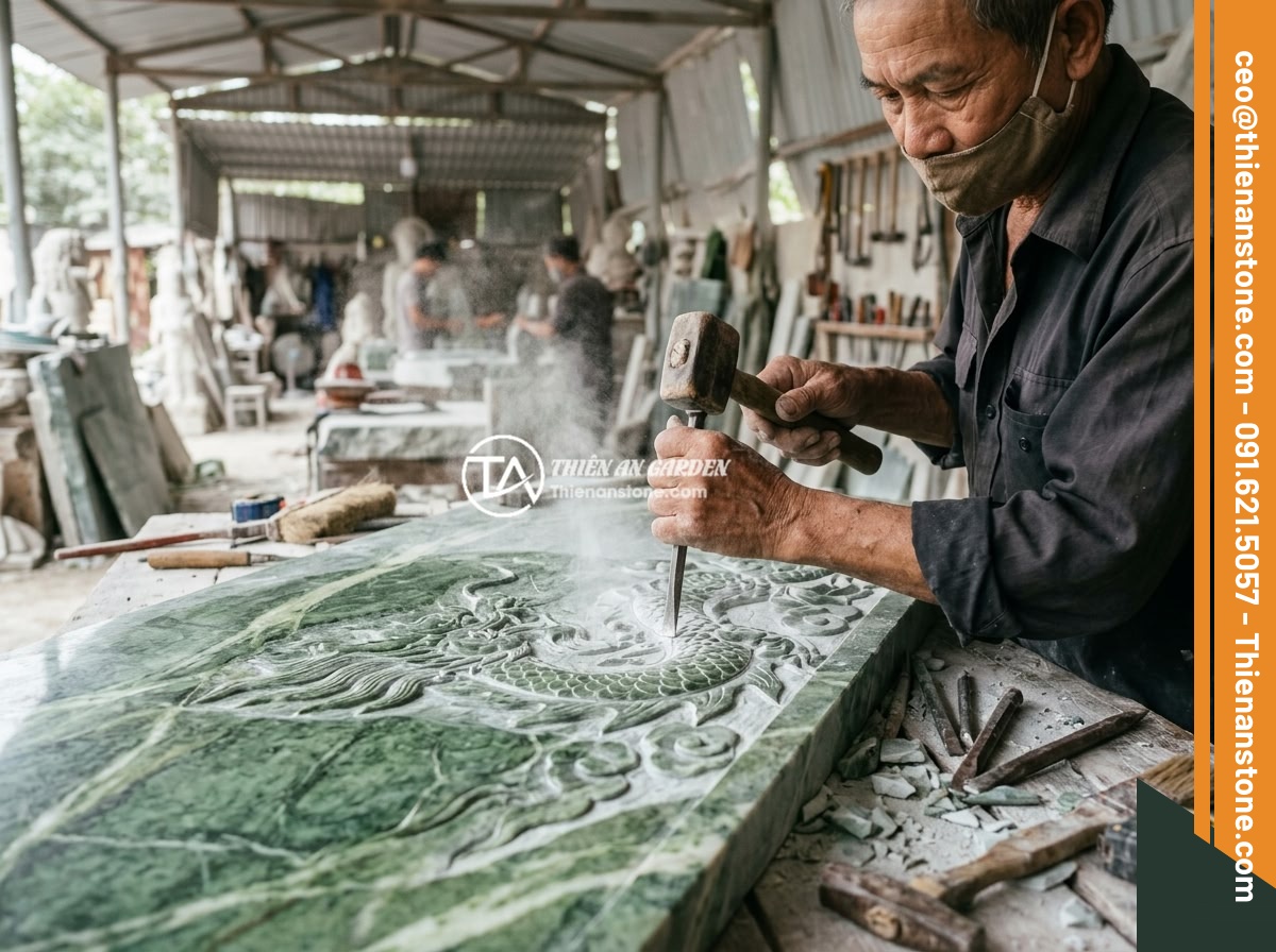 Case Study Thực Tế Thi Công Sập Đá Nguyên Khối Cho Biệt Thự Miền Bắc Việt Nam - Master artisans carefully hand-carving intricate dragon and cloud motifs on a la