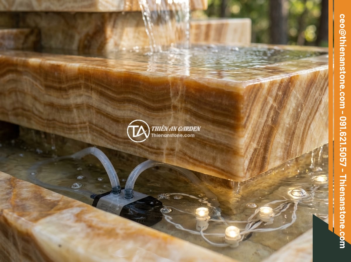 Checklist 10 Tiêu Chí Chọn Đài Phun Nước Bằng Đá Chất Lượng Cao Cho Gia Đình - Detailed view of a multi-tier stone fountain with gentle water cascading effect,