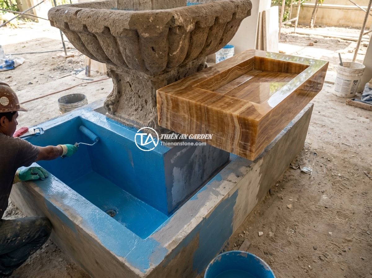 Đài Phun Nước Bằng Đá Bị Rò Rỉ Nước: Cách Tìm Và Khắc Phục Triệt Để - A construction worker applying polyurethane waterproof coating to the interior o