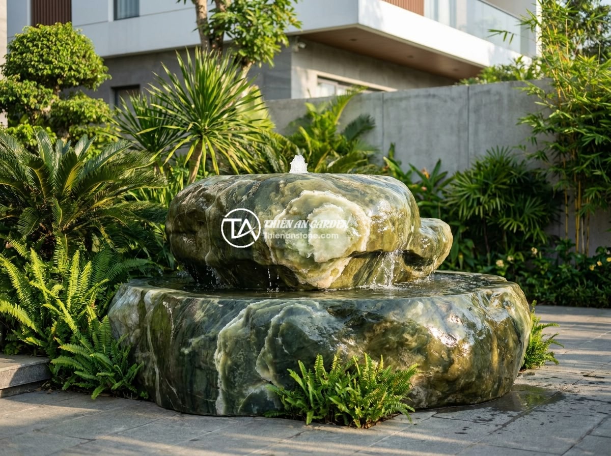 Đài Phun Nước Bằng Đá Cho Biệt Thự: Gợi Ý Thiết Kế & Bố Trí Tối Ưu Phong Thủy - A luxurious natural stone water fountain placed in the front yard of a modern Vi