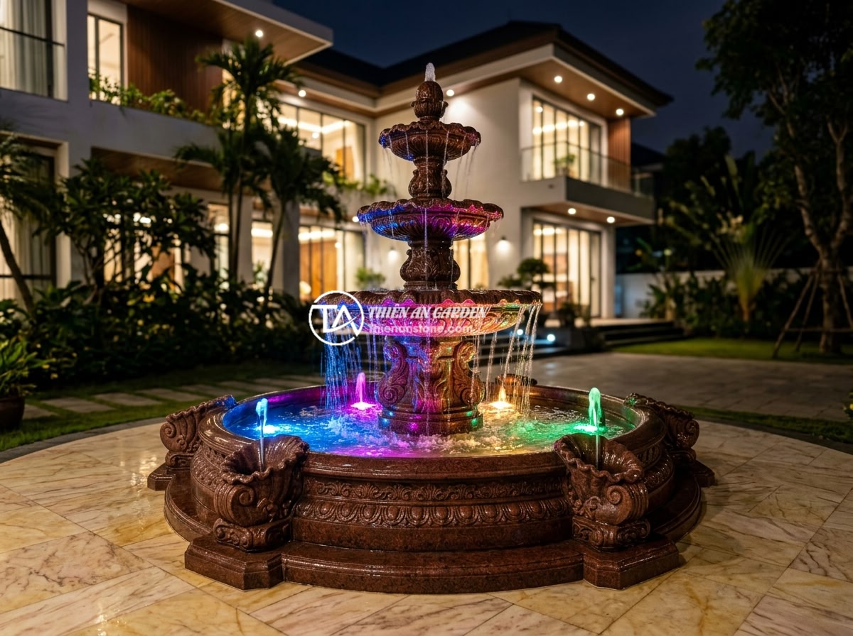 Giá Đài Phun Nước Bằng Đá Bazan Granite 2026 – Cập Nhật Bảng Giá Mới Nhất - Hình 9 Giá Đài Phun Nước Bằng Đá Bazan Granite 2026 – Cập Nhật Bảng Giá Mới Nhất - A luxurious three-tiered red granite fountain with classical European carved det