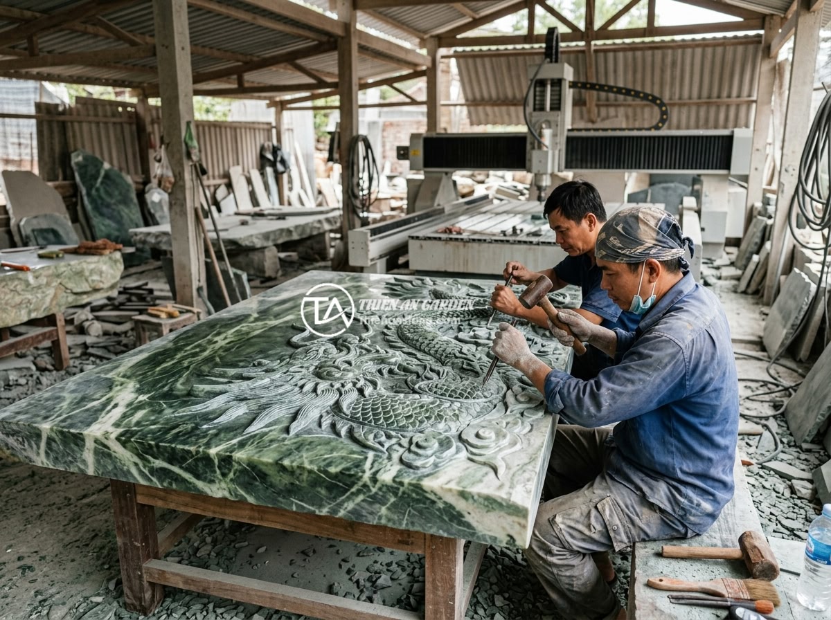 Giá Sập Đá Nguyên Khối 2026 Bao Nhiêu Tiền? Bảng Giá Chi Tiết Cập Nhật Mới Nhất - Vietnamese stone artisans carefully hand-carving intricate dragon patterns on a 