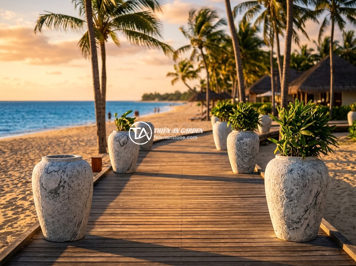 Lục Bình Đá Cho Resort & Homestay: Tạo Không Gian Sang Trọng, Gần Gũi Với Thiên Nhiên - A tropical beachfront resort with white granite stone vases placed along a woode