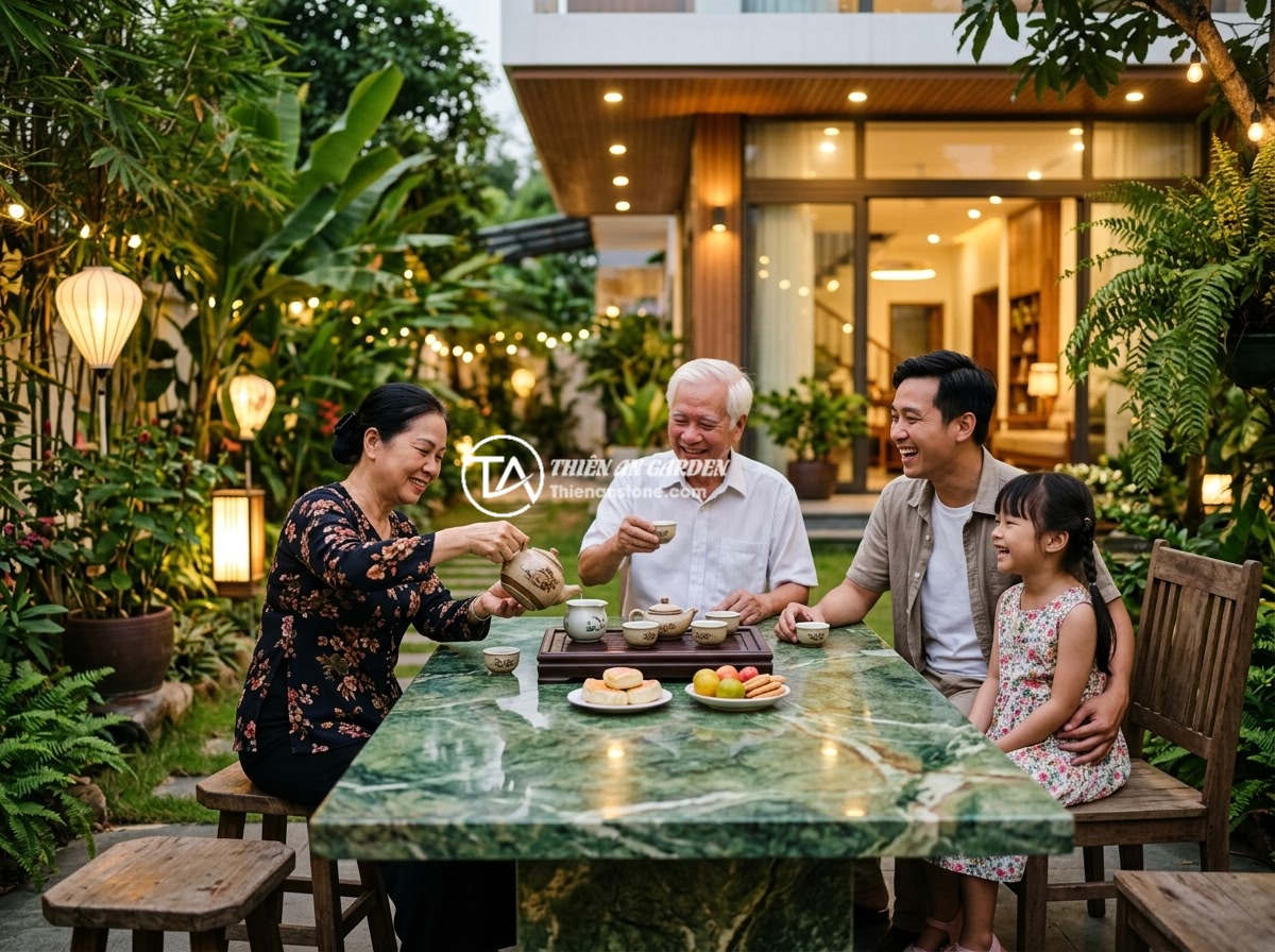 Sập Đá Cổ Có Phù Hợp Sân Vườn Hiện Đại Không? Phân Tích Ưu Nhược Điểm - A Vietnamese family enjoying tea time around a beautifully placed antique stone 