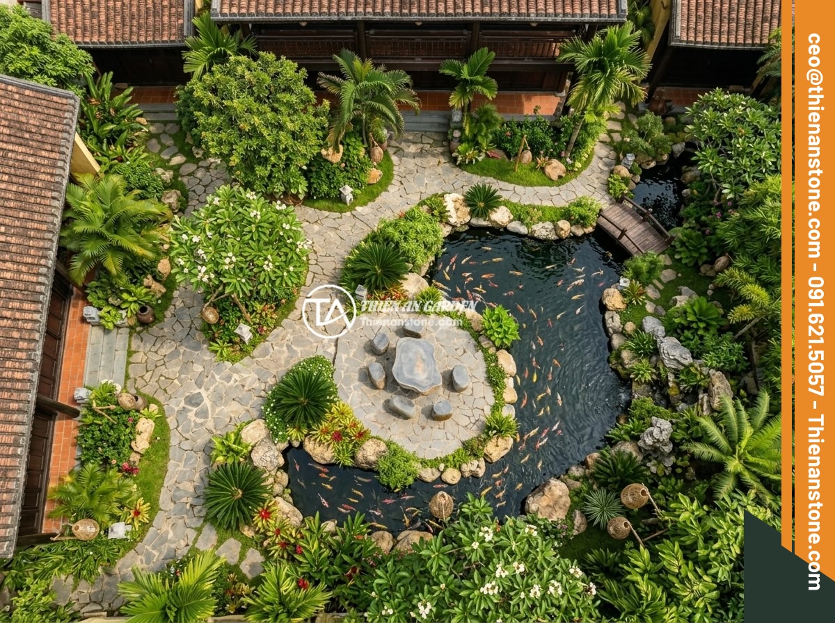 Sập Đá Phong Thủy Sân Vườn: Ý Nghĩa Vị Trí Đặt Hợp Lý Lợi Ích Cho Gia Đình - Hình 9 Sập Đá Phong Thủy Sân Vườn: Ý Nghĩa Vị Trí Đặt Hợp Lý Lợi Ích Cho Gia Đình - An aerial view of a luxury Vietnamese villa garden featuring a stone table set s