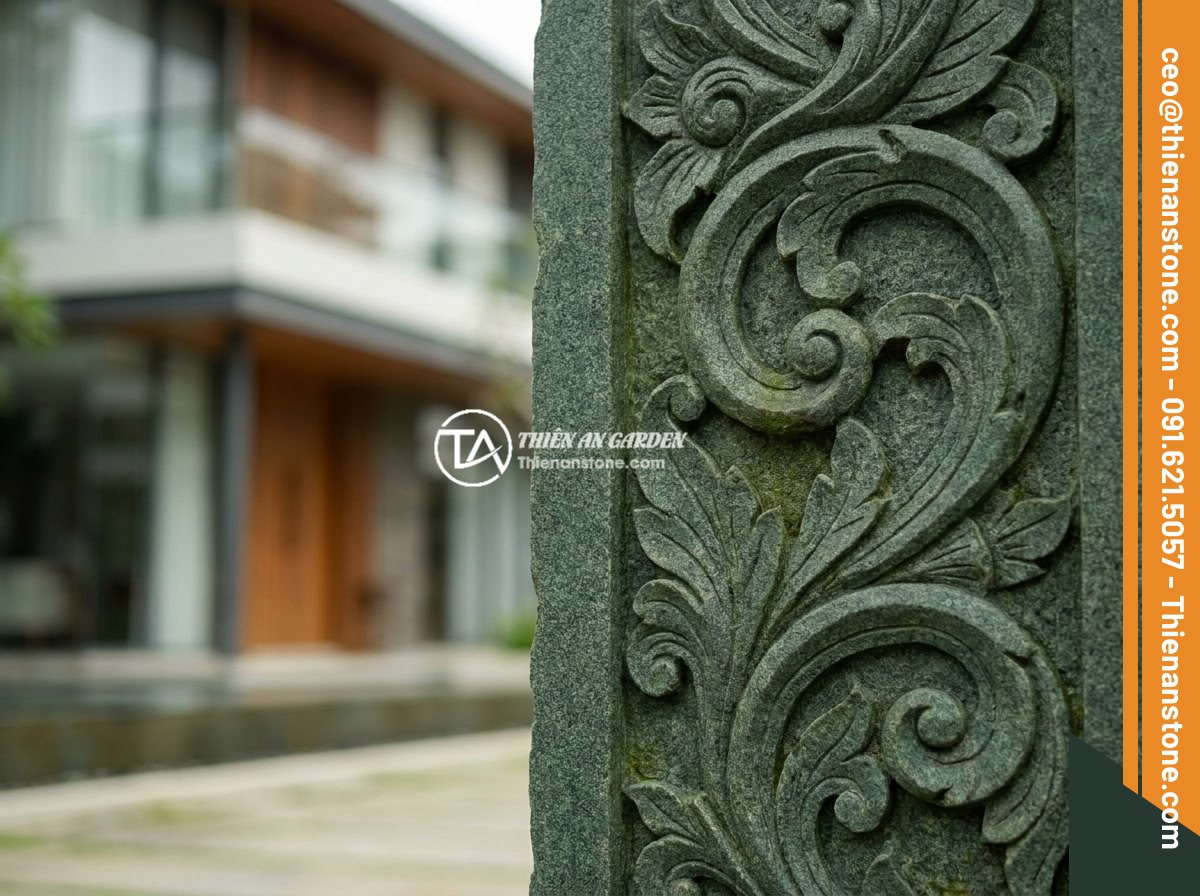 Top 7 Mẫu Trụ Cổng Hàng Rào Đá Đẹp Phù Hợp Biệt Thự Hiện Đại - Close-up of beautifully carved natural green stone gate pillar with floral motif