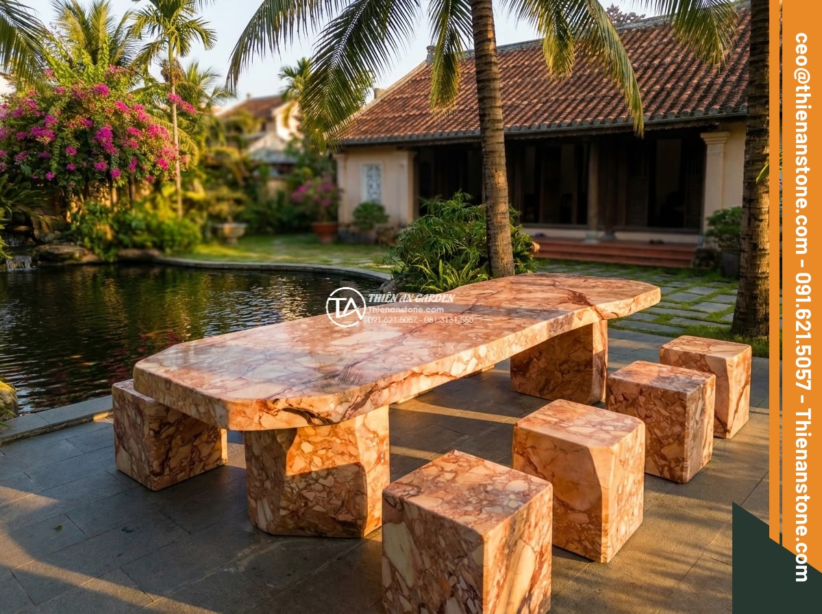Bàn ghế đá huyết long - Hình 3 Bàn ghế đá huyết long - Dramatic golden hour aerial view of an elegant blood dragon stone table and chai