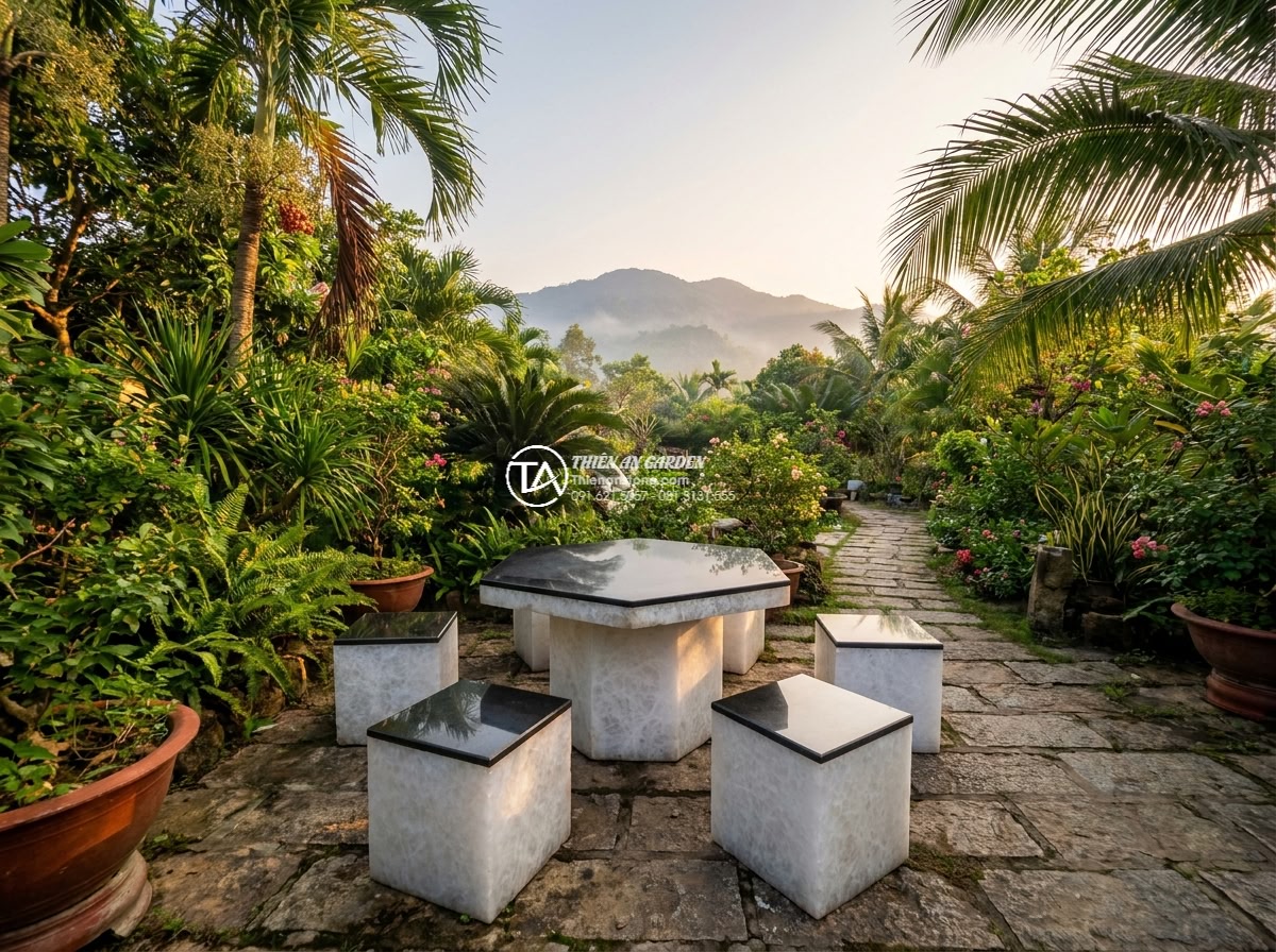 Bàn ghế đá trắng muối - Wide cinematic view of a luxurious Vietnamese garden patio featuring an elegant
