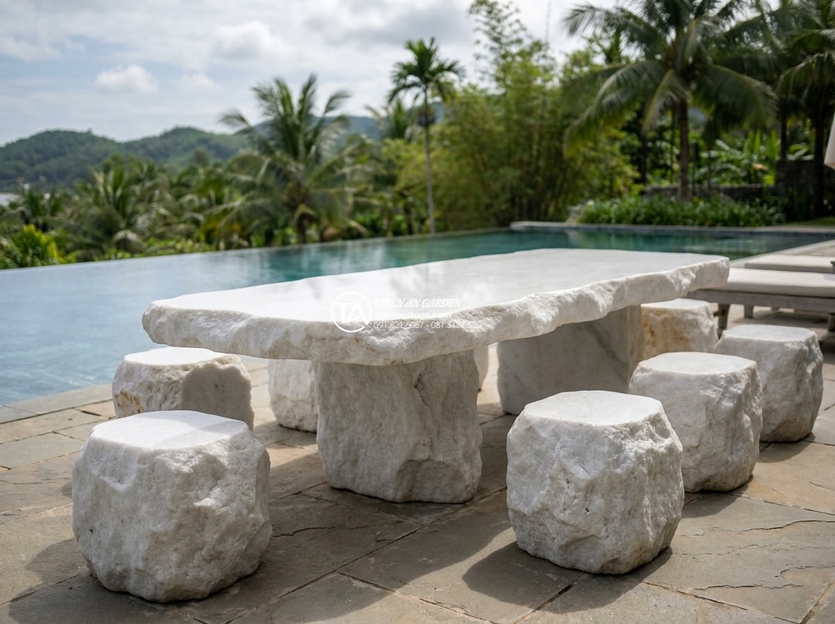 Bàn ghế đá trắng muối - Hình 20 Bàn ghế đá trắng muối - High-end resort patio featuring white marble stone furniture with pool and tropi