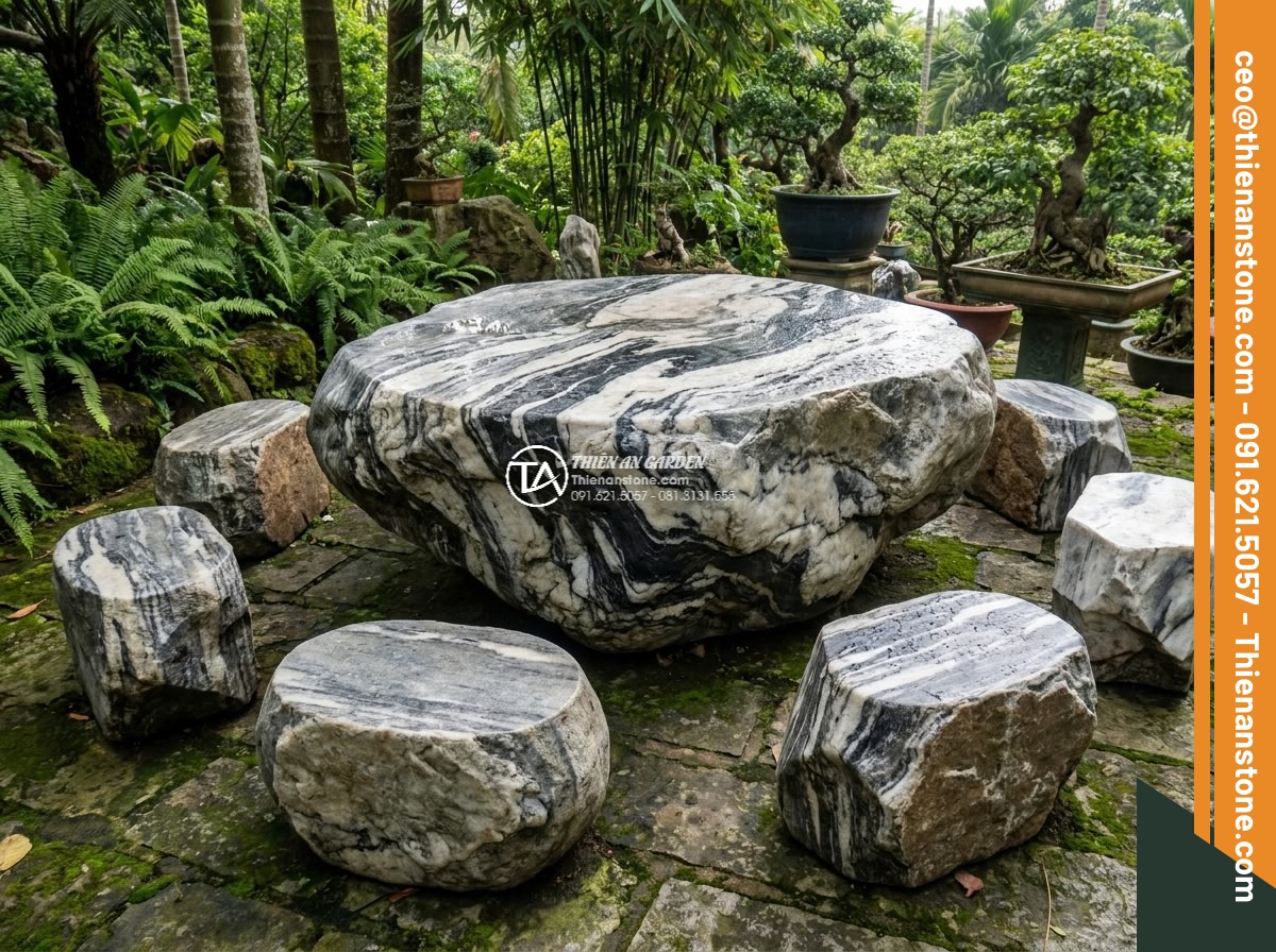 Bàn ghế đá Tuyết sơn - Hình 4 Bàn ghế đá Tuyết sơn - Photorealistic image of a person's hand gently touching the smooth cool surface