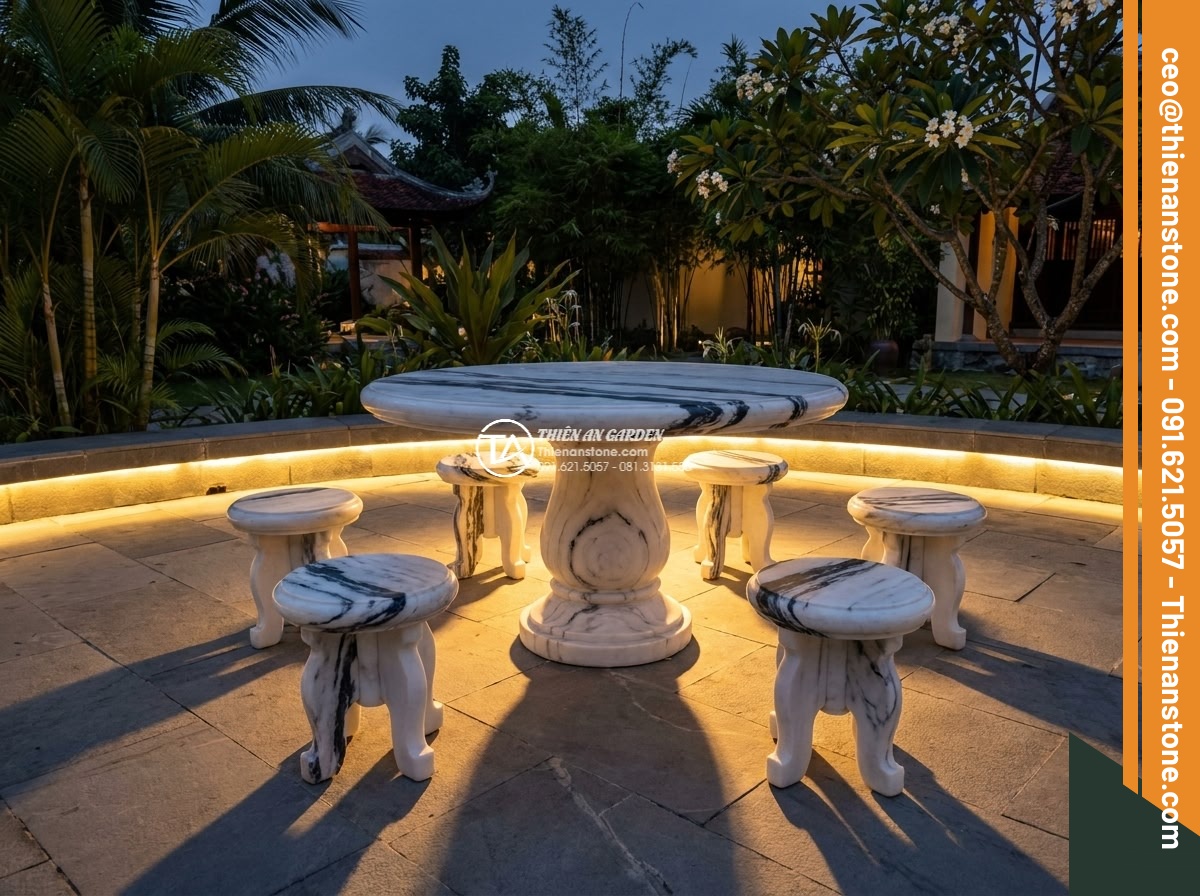 Bàn ghế đá Tuyết sơn - Hình 5 Bàn ghế đá Tuyết sơn - Cinematic photorealistic evening scene of white Tuyet Son stone garden furniture