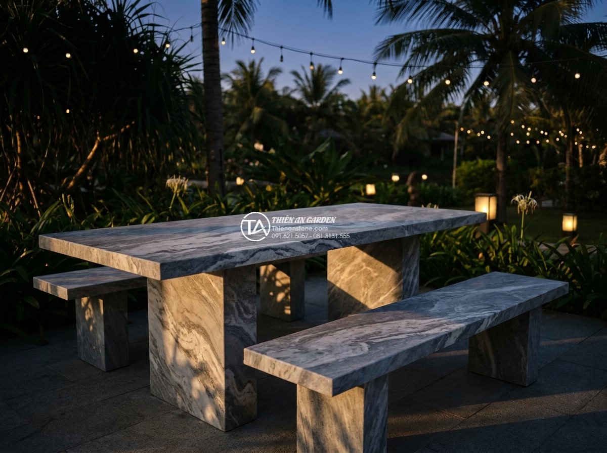Bàn ghế đá vân mây - Hình 7 Bàn ghế đá vân mây - Stunning cinematic photograph of the same cloud-vein marble garden table and cha