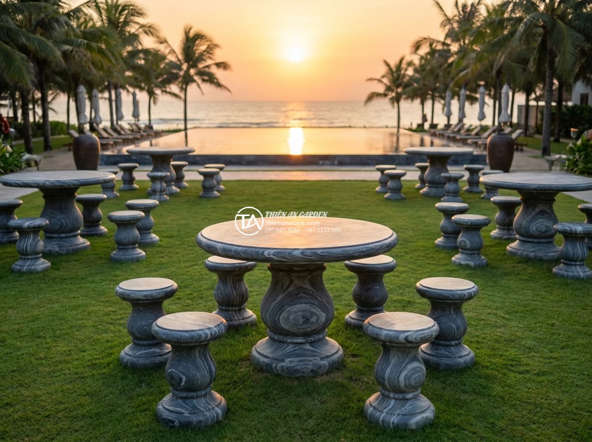 Bàn ghế đá vân mây - Hình 9 Bàn ghế đá vân mây - Wide cinematic establishing shot of a high-end beachfront resort garden in Vietn