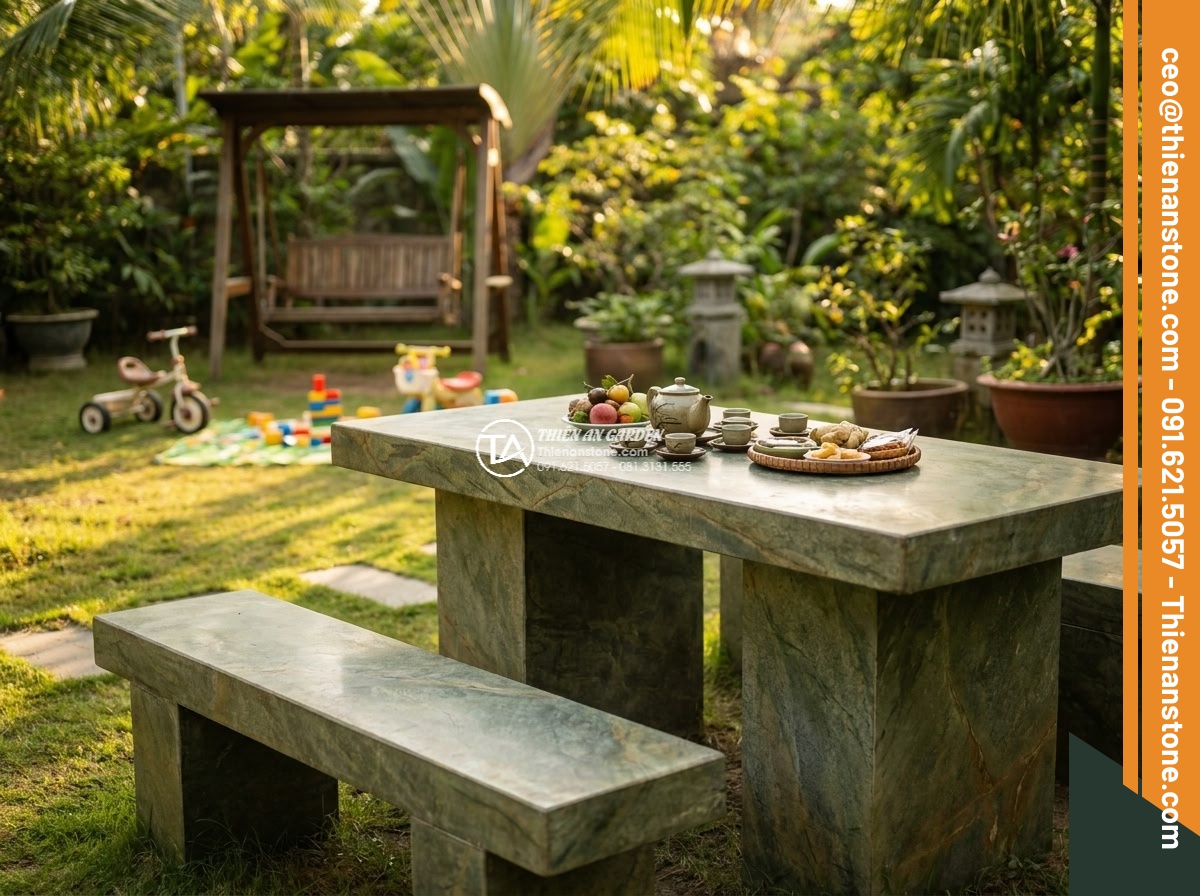 Bàn ghế đá xanh rêu - Hình 10 Bàn ghế đá xanh rêu - Lifestyle shot of a family enjoying afternoon tea at a moss green stone table se